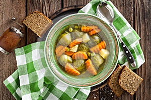 Vegetable soup with brussel sprouts on wooden rustic table