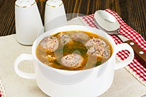 Vegetable soup with curry and sausage