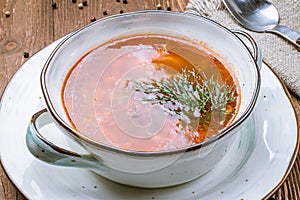 Vegetable soup minestrone on wooden table