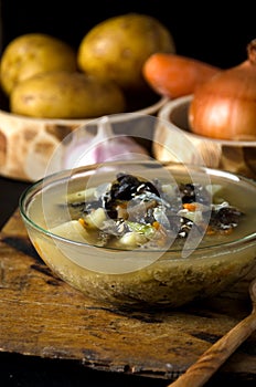 Vegetable soup mushrooms glass bowl spoon