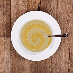 Vegetable soup on a wooden table