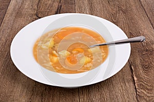 Vegetable soup on a wooden table