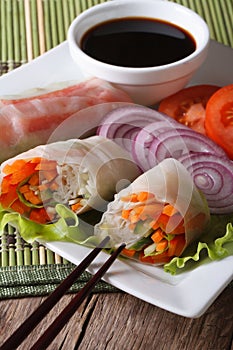 Vegetable spring rolls on a plate close-up. Vertical