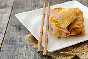 Vegetable spring rolls on wood