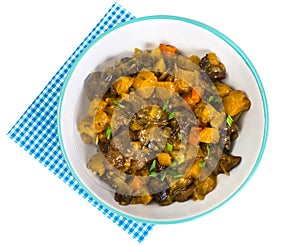 Vegetable stew in a plate on white background