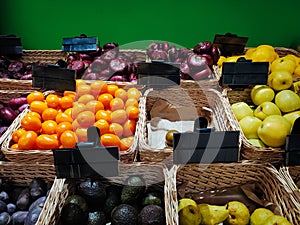 A vegetable store with empty black price tags. Fresh vegetables on the shelves at the supermarket, mockup price. Vegetable shop or