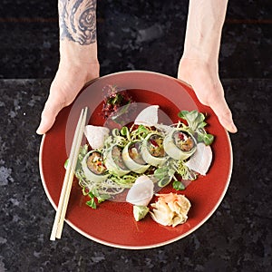 Vegetable sushi rolls with fish