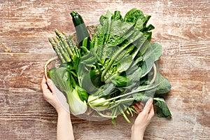 Vegetables background. Various vegetables in a basket on kitchen table. Clean eating, healthy food concept