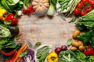 Vegetables background. Various vegetables on kitchen table. Clean eating, healthy food concept