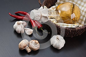 vegetables and  basket with  bottle of vinegar