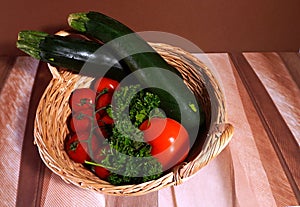 vegetables in basket tomatoes parsley zucchini