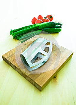 Vegetables, board and chopper