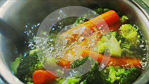 Vegetables boiling in hot water