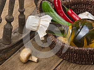 Vegetables and  bottle of cooking oil in a basket