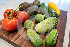 Vegetables on butcher block cutting board