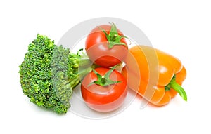 Vegetables close-up. sweet peppers, two tomatoes and broccoli on