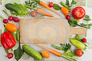 Vegetables and cutting board top view with copy space. Cooking vegan food concept