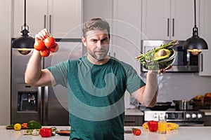 Vegetables diet. Young woman eating healthy food, dieting. Guy eating vegetable diet salad in studio. Vegan salad. Male