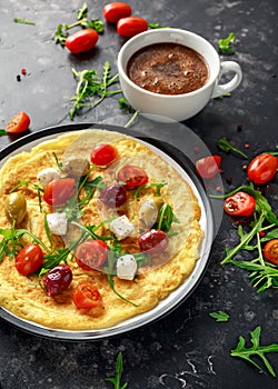 Vegetables Eggs Omelette with tomatoes, wild rocket, greek cheese, olives and coffee. Morning breakfast. healthy food