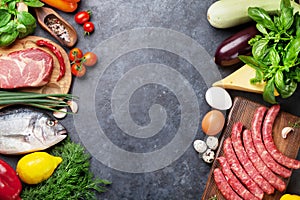 Vegetables, fish, meat and ingredients cooking