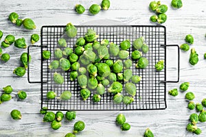 Vegetables. Fresh green brussels sprouts on a white wooden background. Rustic style.