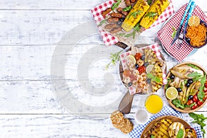 Vegetables, fruits and shrimp on the grill, for a summer lunch. Healthy food. Appetizers on a white background. Copy space. flat
