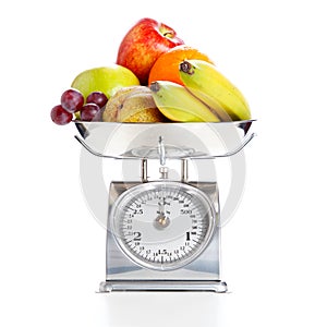 Vegetables and fruits on a weighing scale