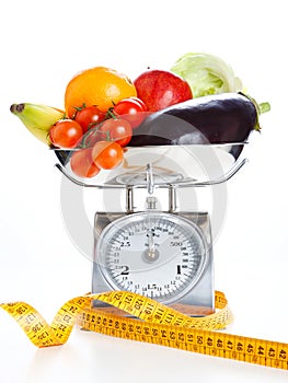 Vegetables and fruits on a weighing scale