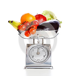 Vegetables and fruits on a weighing scale