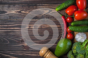 Vegetables and fruits on a wooden background. Healthy eating. Top view.