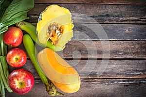 Vegetables and fruits on wooden table photo