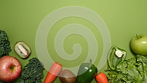 Vegetables on green background with copy space. Healthy food concept.