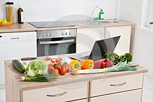 Vegetables With Laptop On A Countertop