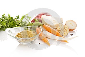 Vegetables with meat on white background. Soup cooking.