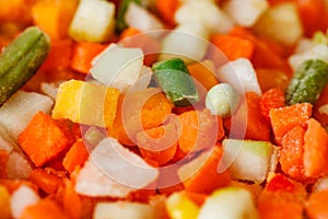 Vegetables mixture of chopped, frozen vegetable string beans, carrots, pumpkin, close-up, selective focus