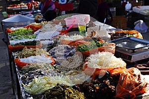 Vegetables and other products in a Shaxi market stall, Yunnan, China