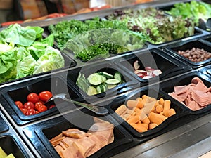 Vegetables in plastic box at the market. Healthy food concept.