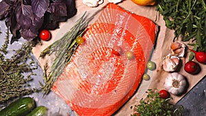 On the vegetables and red fish on the table fall seasonings and small cherry tomatoes