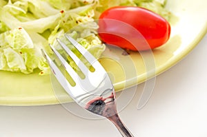 Vegetables salad served on a yellow plate