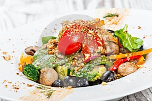 Vegetables salad with spinach, mushrooms, tomatoes, onions, cucumbers, broccoli