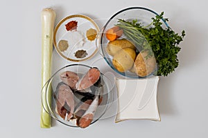 Vegetables and salmon for fish soup. Culinary background with selective focus