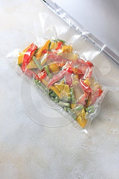 Vegetables in sealed vacuum packing bags. Su-video cooking.