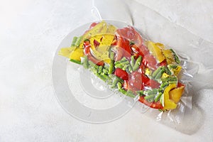 Vegetables in sealed vacuum packing bags. Su-video cooking.