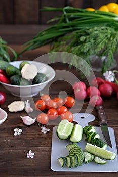 Vegetables sliced for a salad on a cutting board