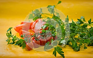 Vegetables - sliced tomato, cherry tomatoes on a branch, parsley