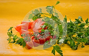 Vegetables - sliced tomato, cherry tomatoes on a branch, parsley