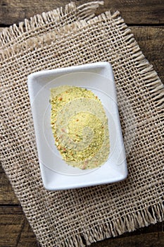 Vegetables and spices dried condiment in a white bowl