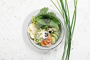 Vegetables summer fruit detox bowl. Vegetarian healthy food. Salads, lettuce leaves, raspberries, green peas, cucumber