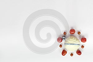 Vegetables tomatoes, cabbage, measuring tape around the cabbage on a white background. healthy, dietary food. a balanced diet