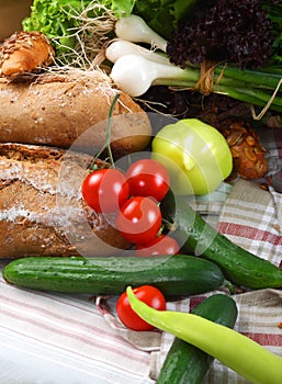 Vegetables and two brads on a table